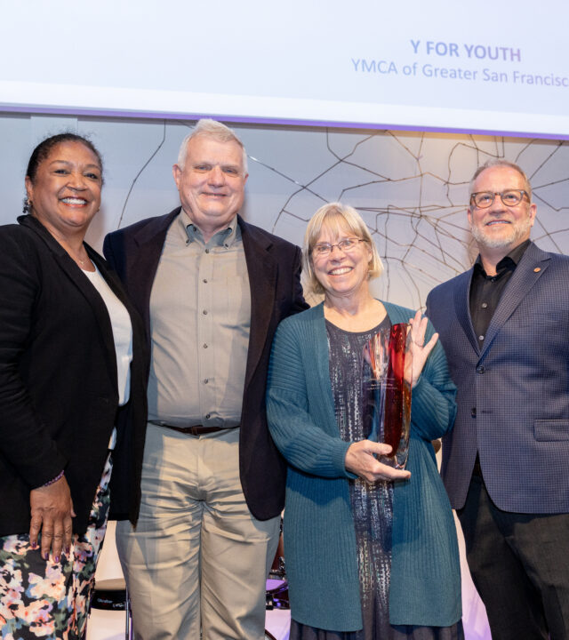 Photo of a group of people receiving an award.